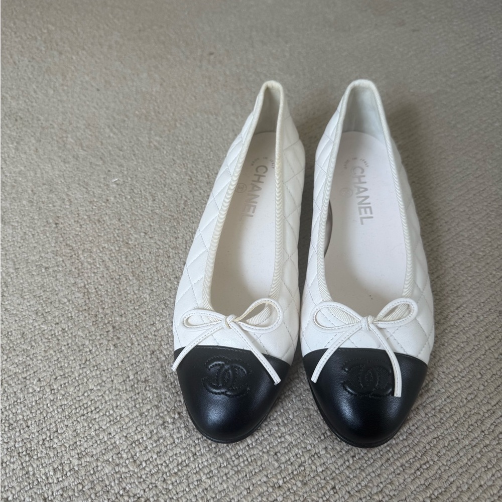 CHANEL Quilted White and Black Loafers